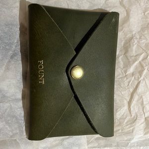 Fount change pure wallet. Color is green . New has never been used